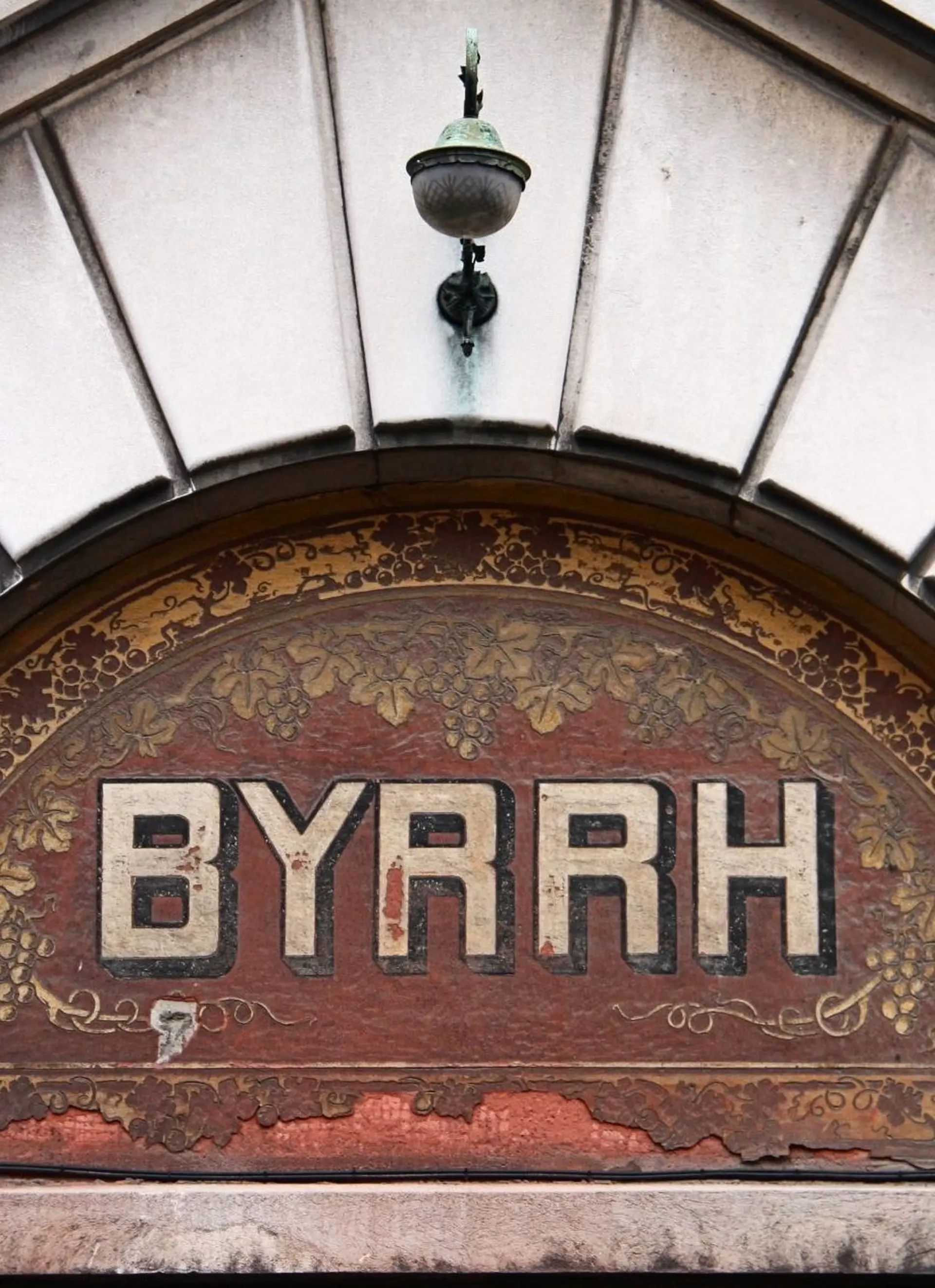 Historic Byrrh sign above an entrance