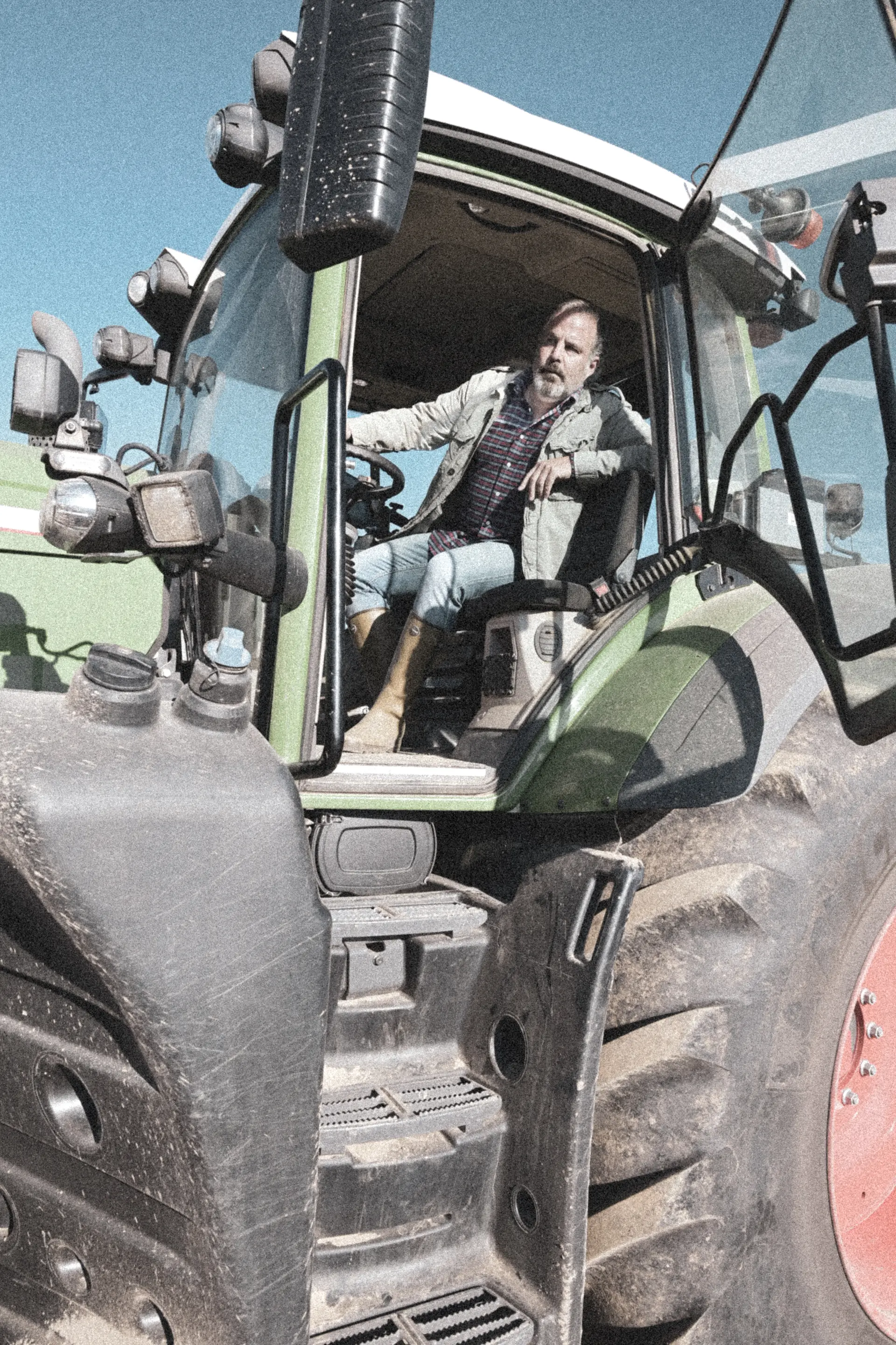 Farmer in a tractor on the potato field