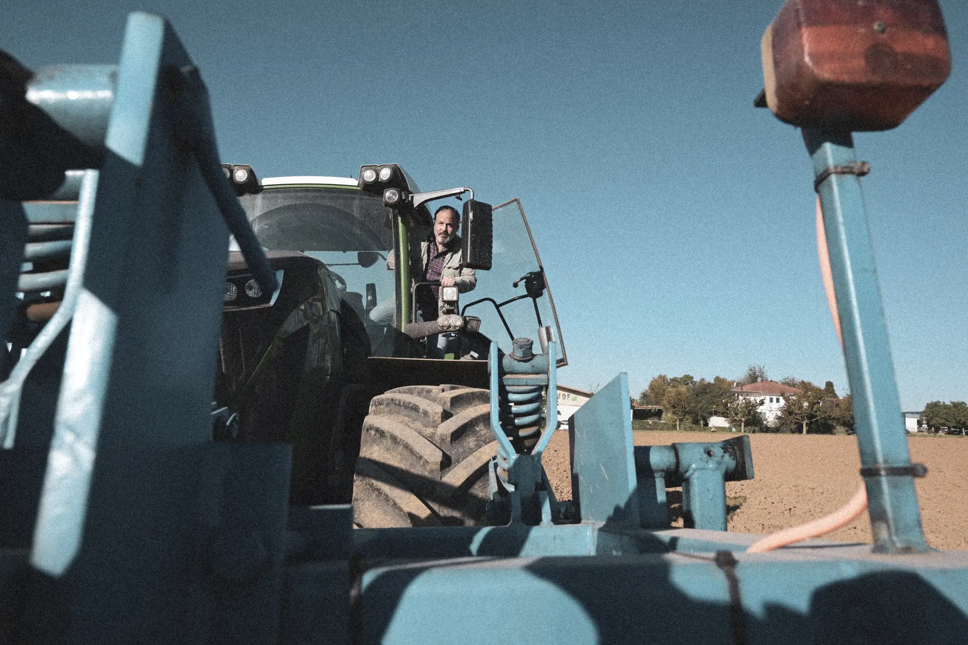Tractor with planting machine, view from the cab