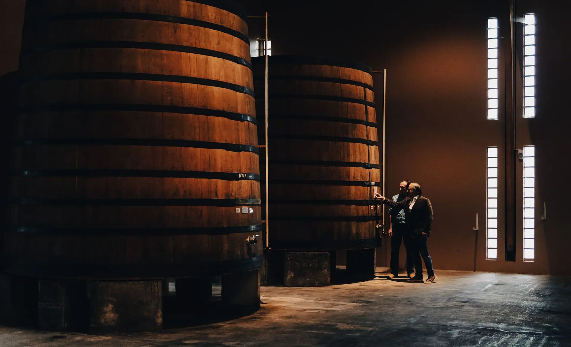 Large wooden vats in the distillery chai