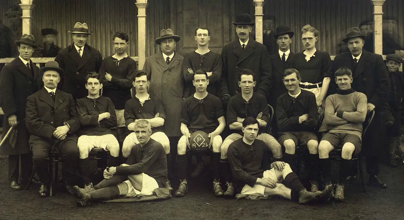 Historic team photo of the Powers distillery