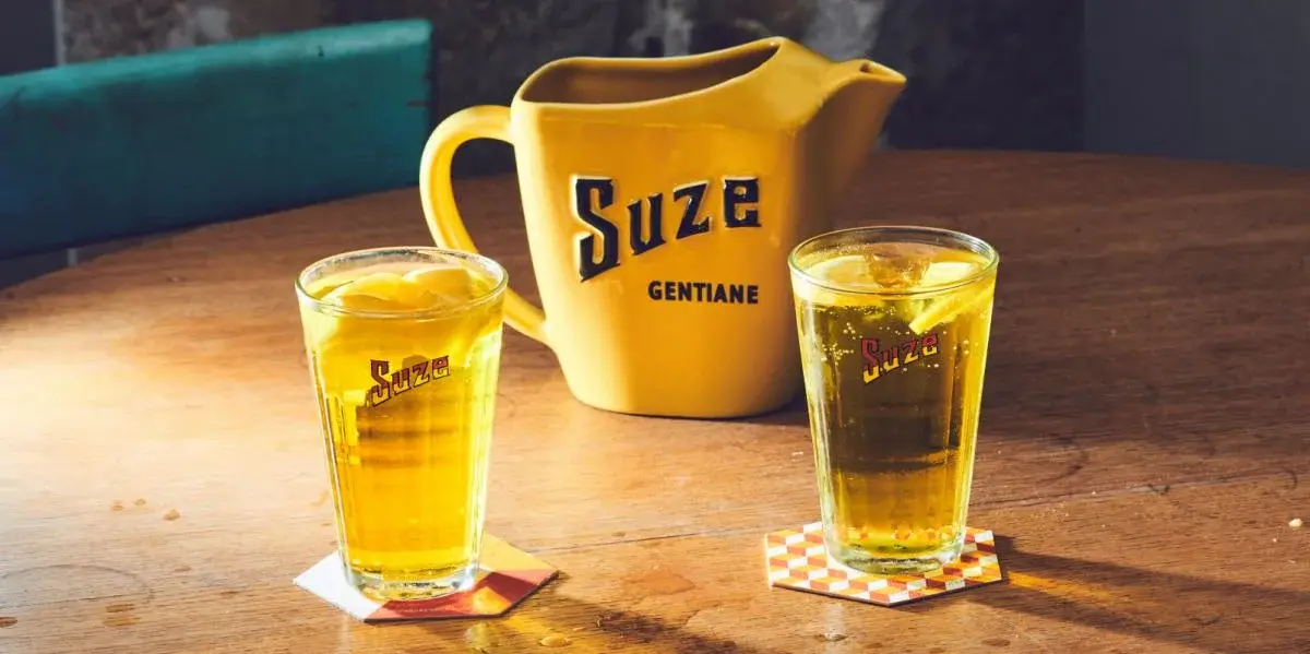 Suze carafe with two glasses of Suze tonic