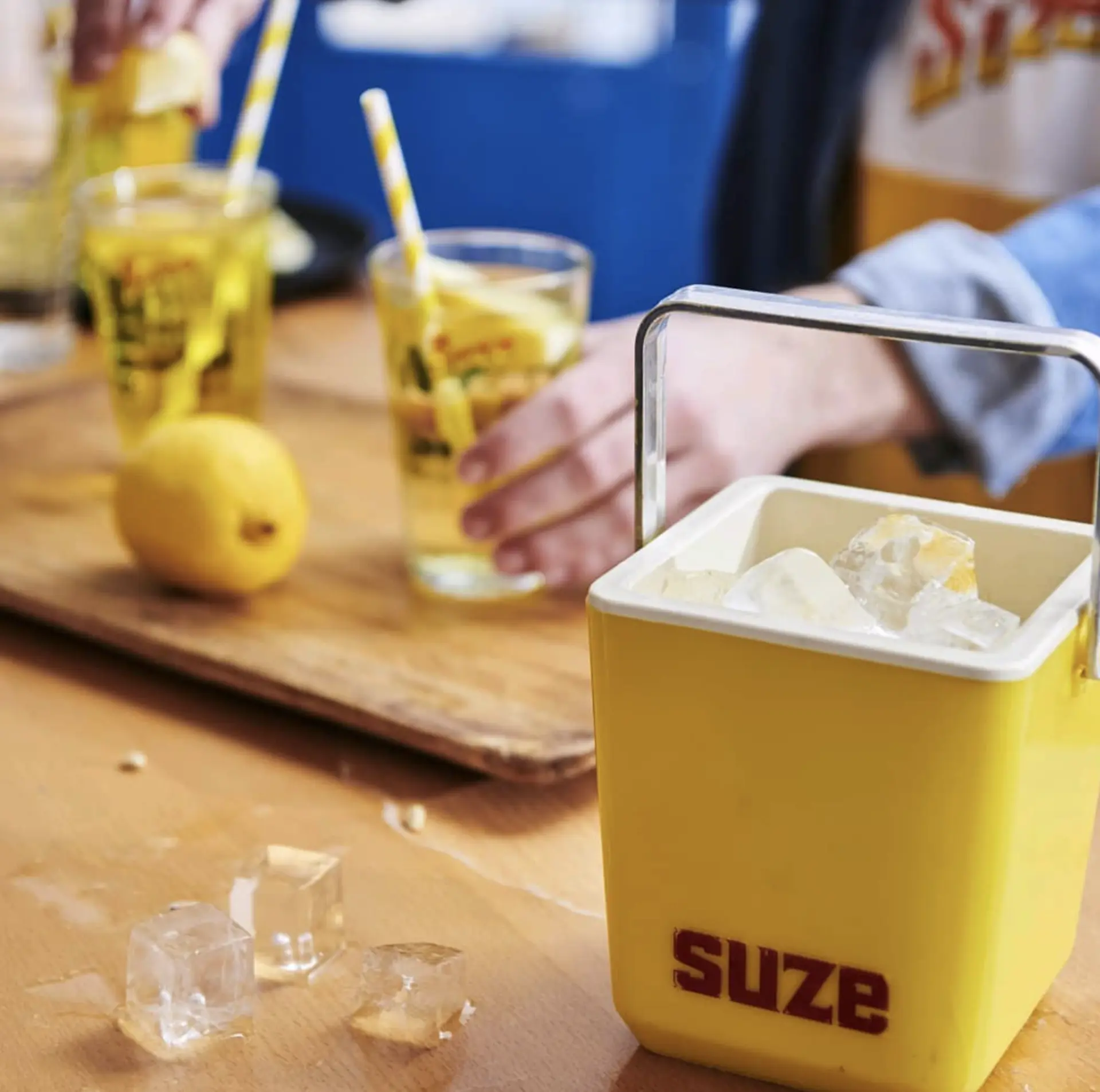 Suze ice bucket and drinks with lemon